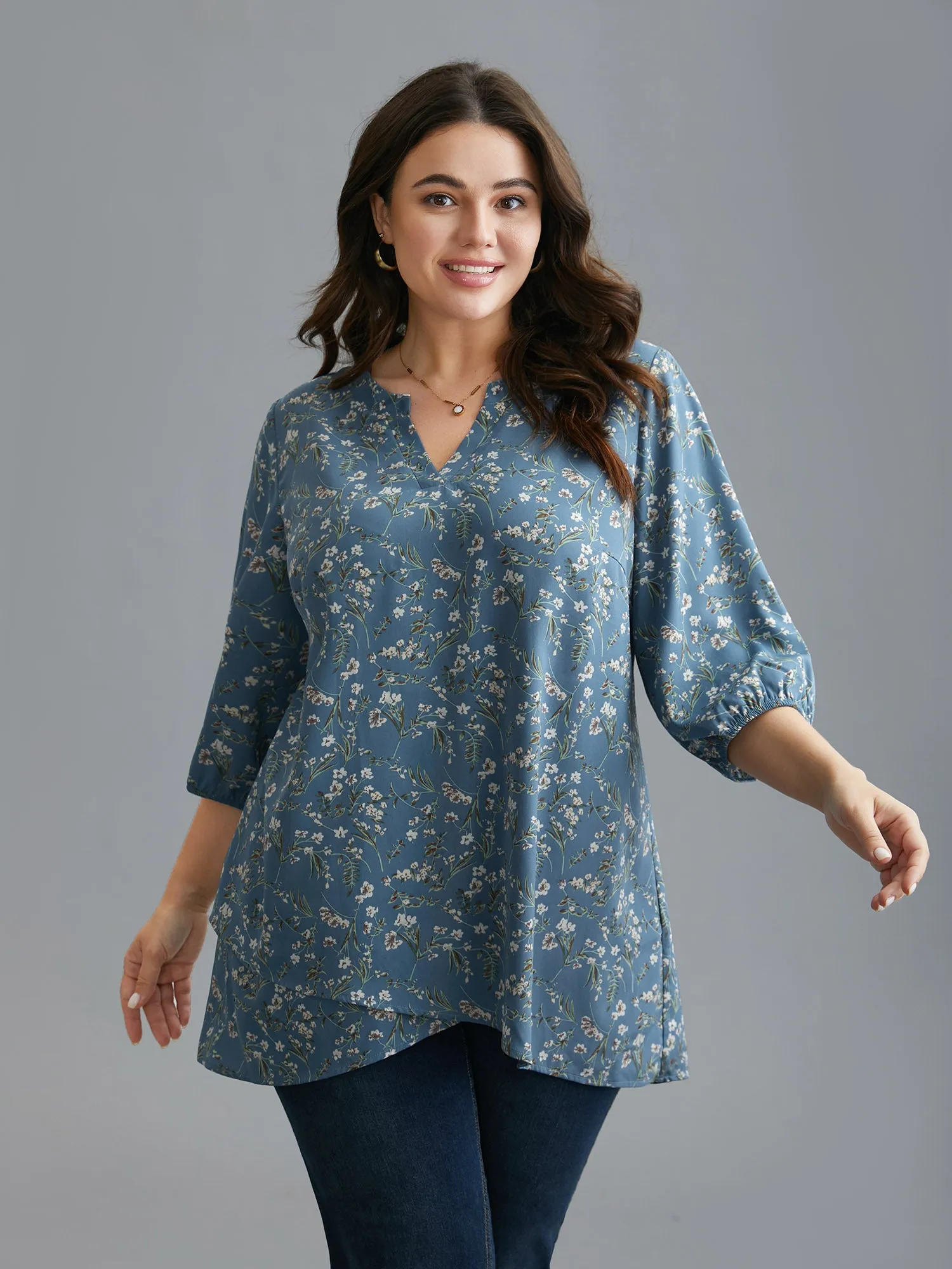 Floral Asymmetrical Hem Elastic Cuff Blouse sold by Bloomchic