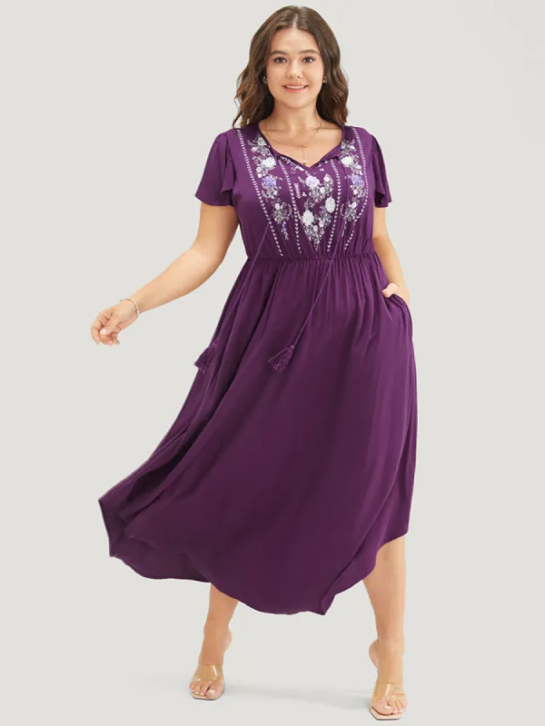 Floral Tie Neck Tassels Pocket Ruffle Arc Hem Dress sold by Bloomchic