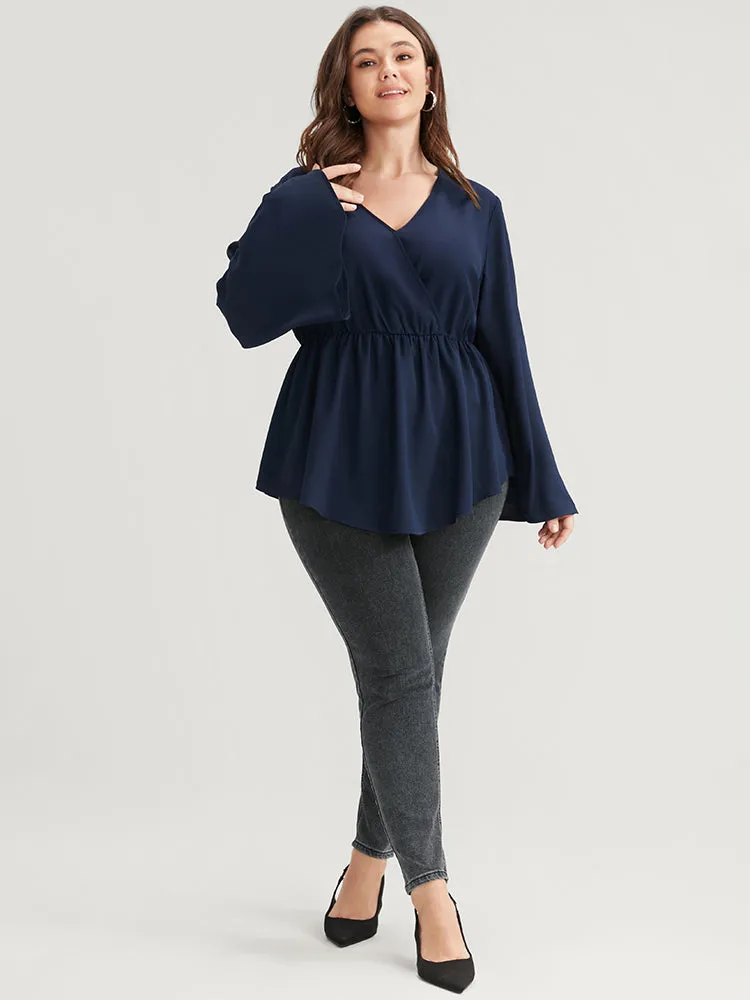 Solid Bell Sleeve Asymmetrical Hem Wrap Blouse sold by Bloomchic product image thumbnail 4