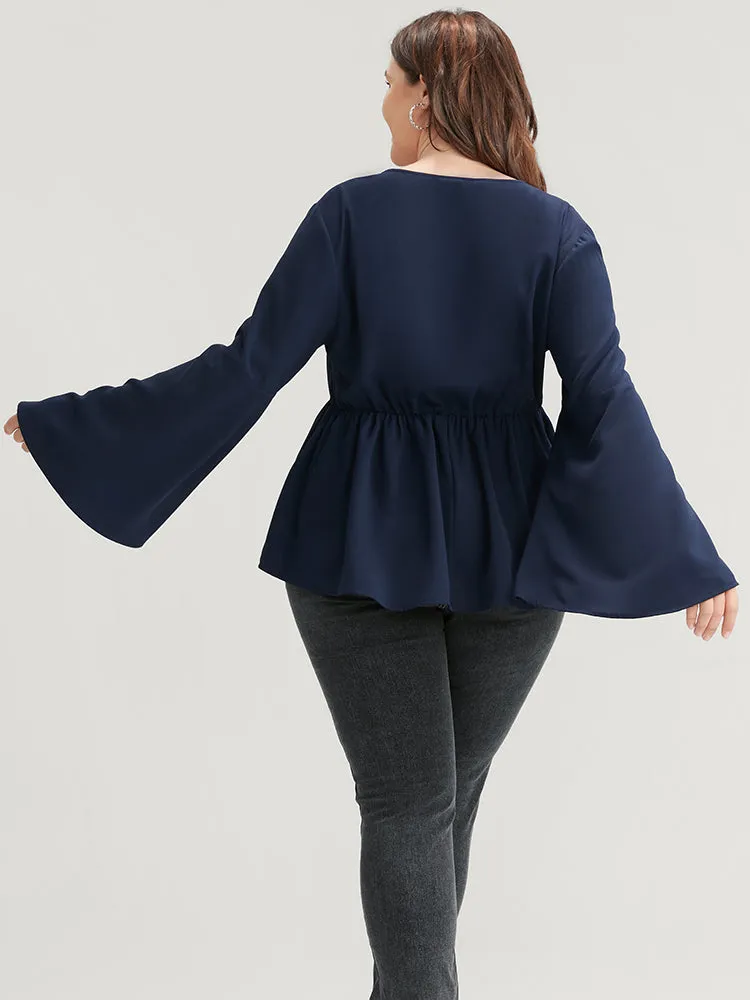 Solid Bell Sleeve Asymmetrical Hem Wrap Blouse sold by Bloomchic product image thumbnail 3
