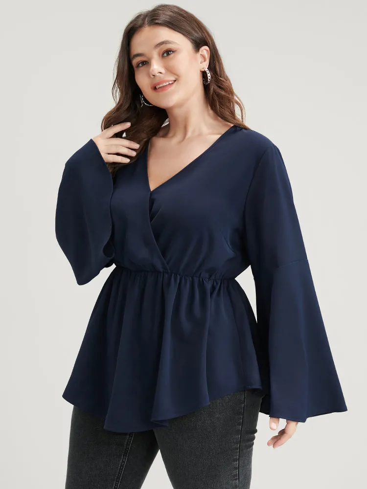Solid Bell Sleeve Asymmetrical Hem Wrap Blouse sold by Bloomchic product image thumbnail 2