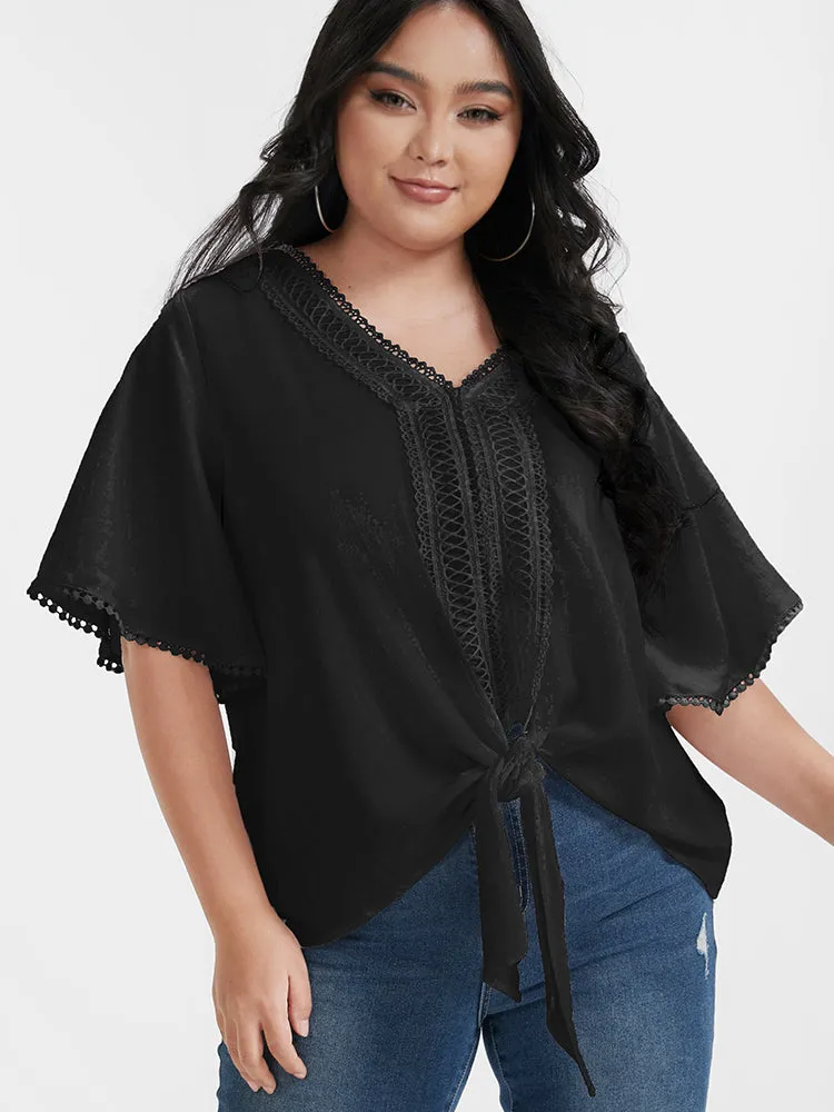 Solid Ties Eyelet Lace Ruffled V Neck Blouse sold by Bloomchic