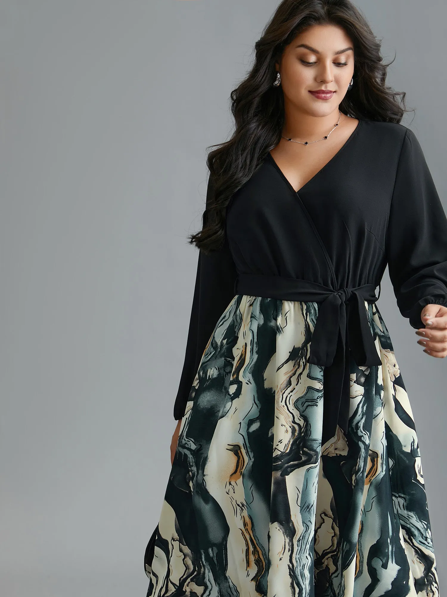 Surplice Neck Marble Print Belted Dress sold by Bloomchic