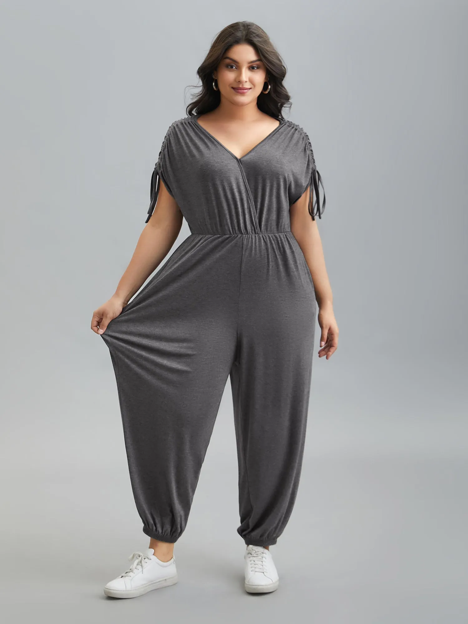 Surplice Neck Drawstring Stretch Jumpsuit sold by Bloomchic