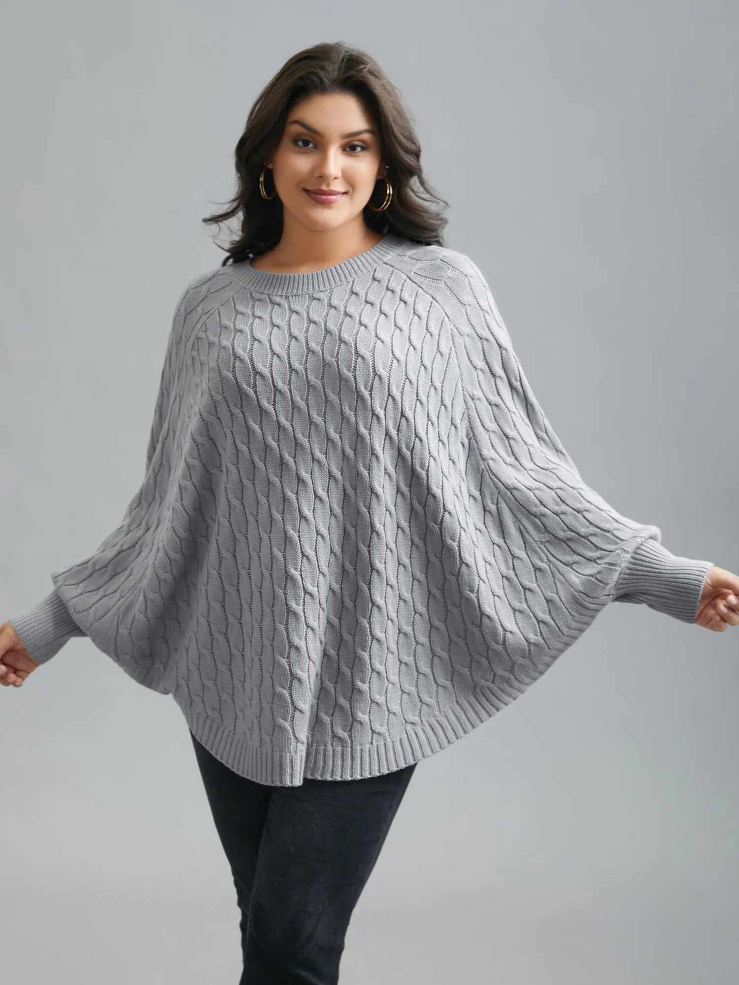 Cable Knit Dolman Sleeve Curved Hem Pullover sold by Bloomchic