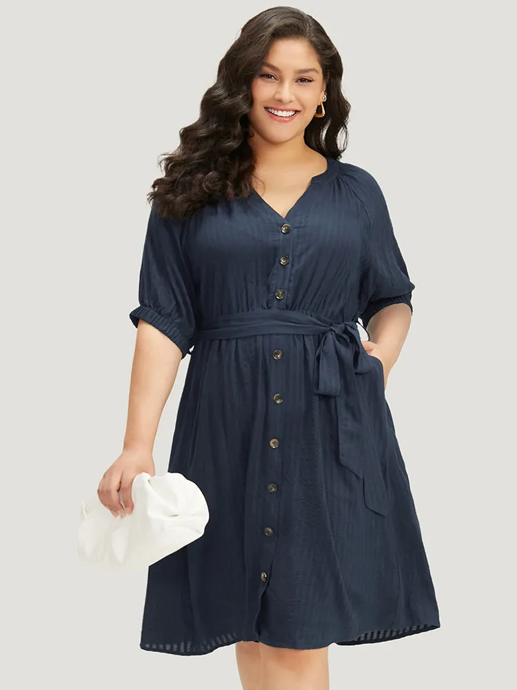 Solid Button Through Notched Belted Dress sold by Bloomchic