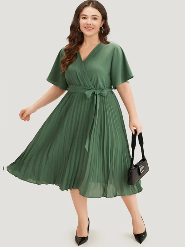 Plain Belted Overlap Collar Pleated Hem Dress sold by Bloomchic