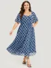 Polka Dot Two Tone Pocket Surplice Neck Dress sold by Bloomchic