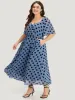 Polka Dot Two Tone Pocket Surplice Neck Dress sold by Bloomchic