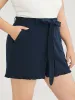 Solid Belted Pocket Ruffle Trim Shorts sold by Bloomchic