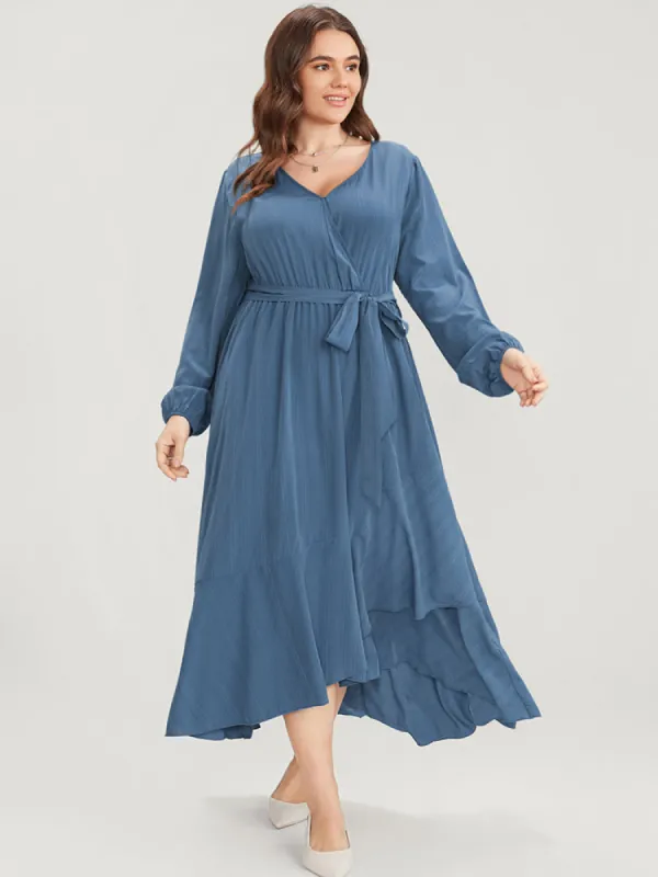 Solid Surplice Neck Lantern Sleeve Pocket Belted Asymmetrical Hem Dress sold by Bloomchic