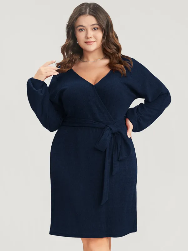 Solid Surplice Neck Belted Knit Dress sold by Bloomchic