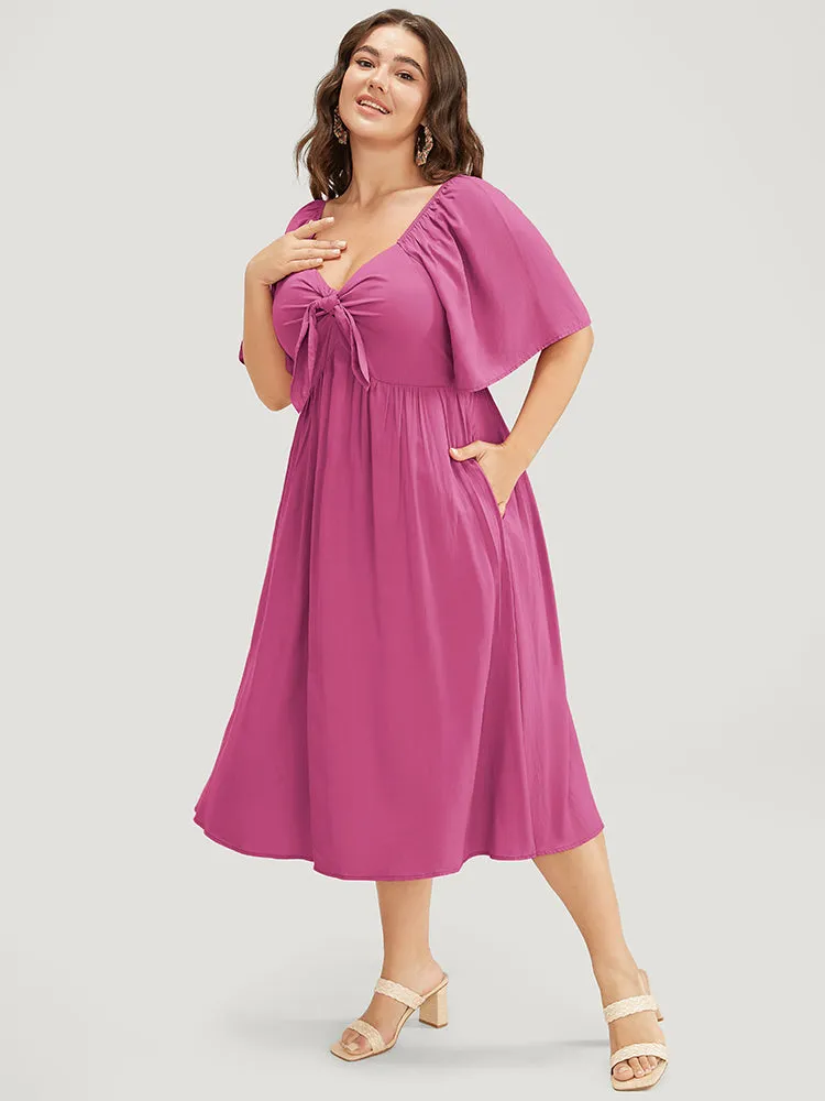 Solid V Neck Ruched Knotted Pocket Ruffle Hem Dress sold by Bloomchic product image thumbnail 3