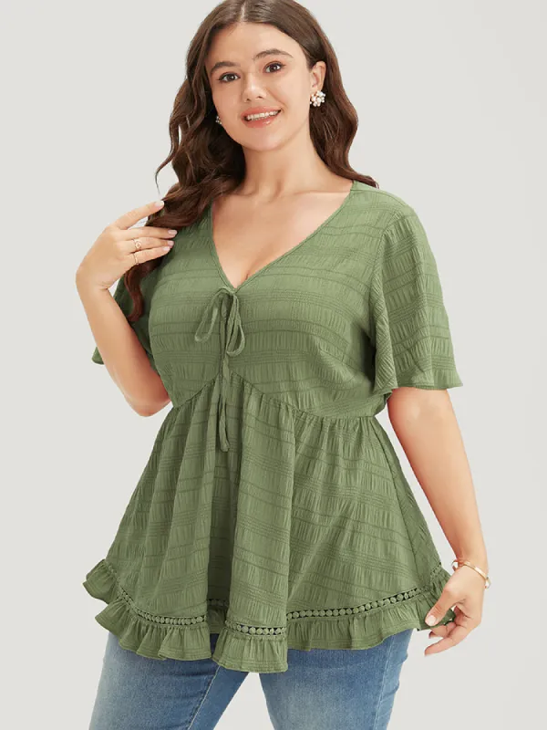 Solid Textured Knot Lace Ruffle Trim Blouse sold by Bloomchic