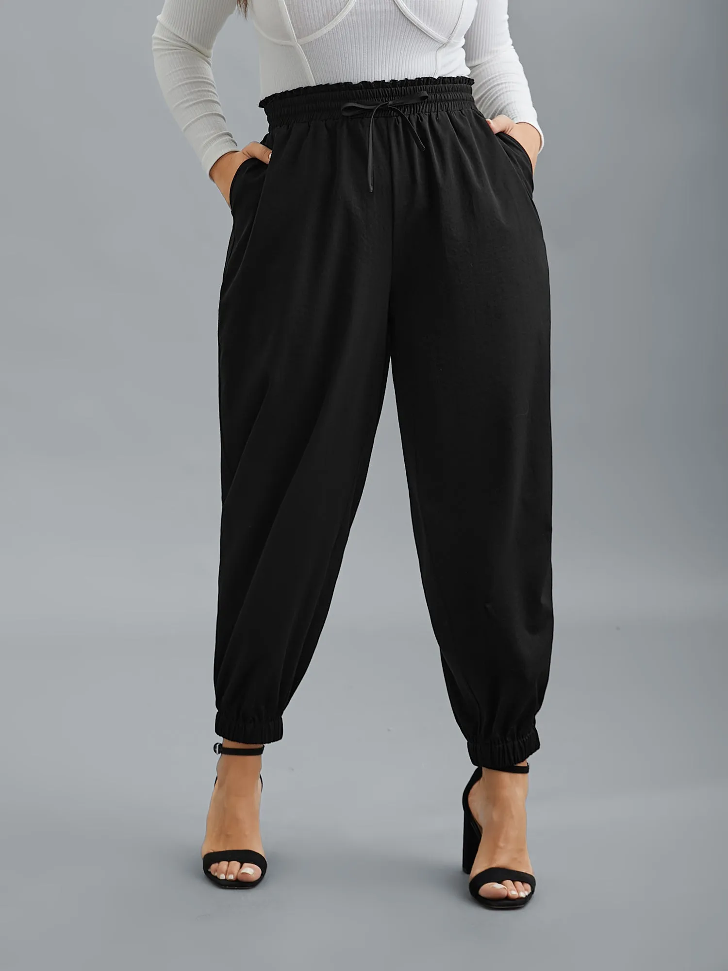 Ruffled Waist Drawstring Tapered Pants sold by Bloomchic