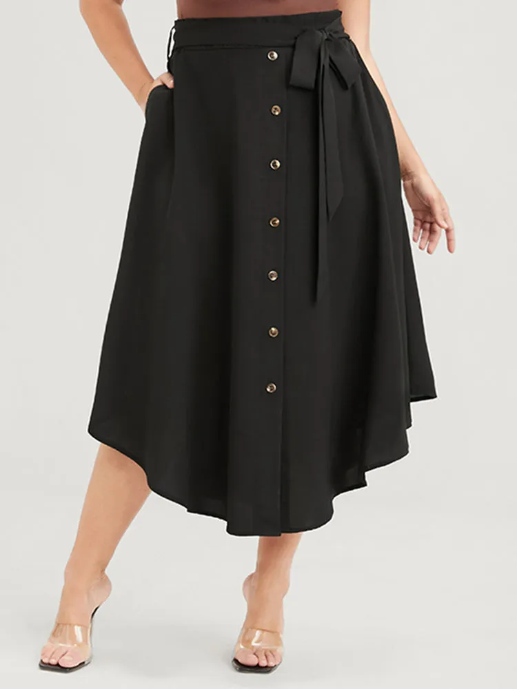 Solid Button Front Pocket Asymmetrical Hem Belted Skirt sold by Bloomchic