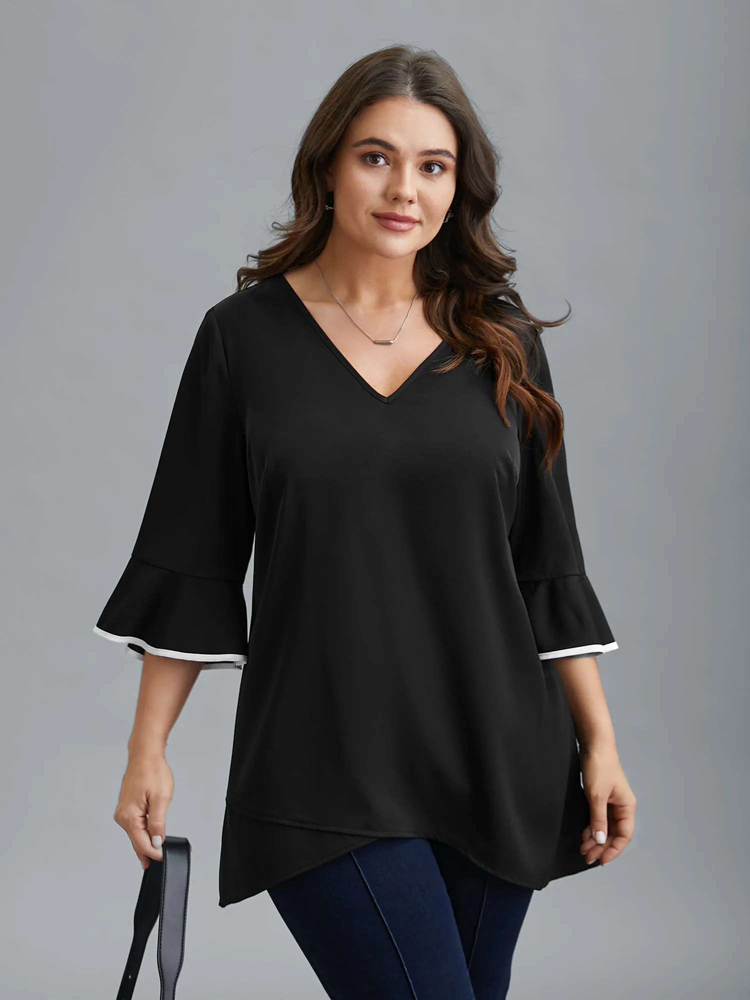 Color-Block Spliced Ruffled Overlap Hem Blouse sold by Bloomchic
