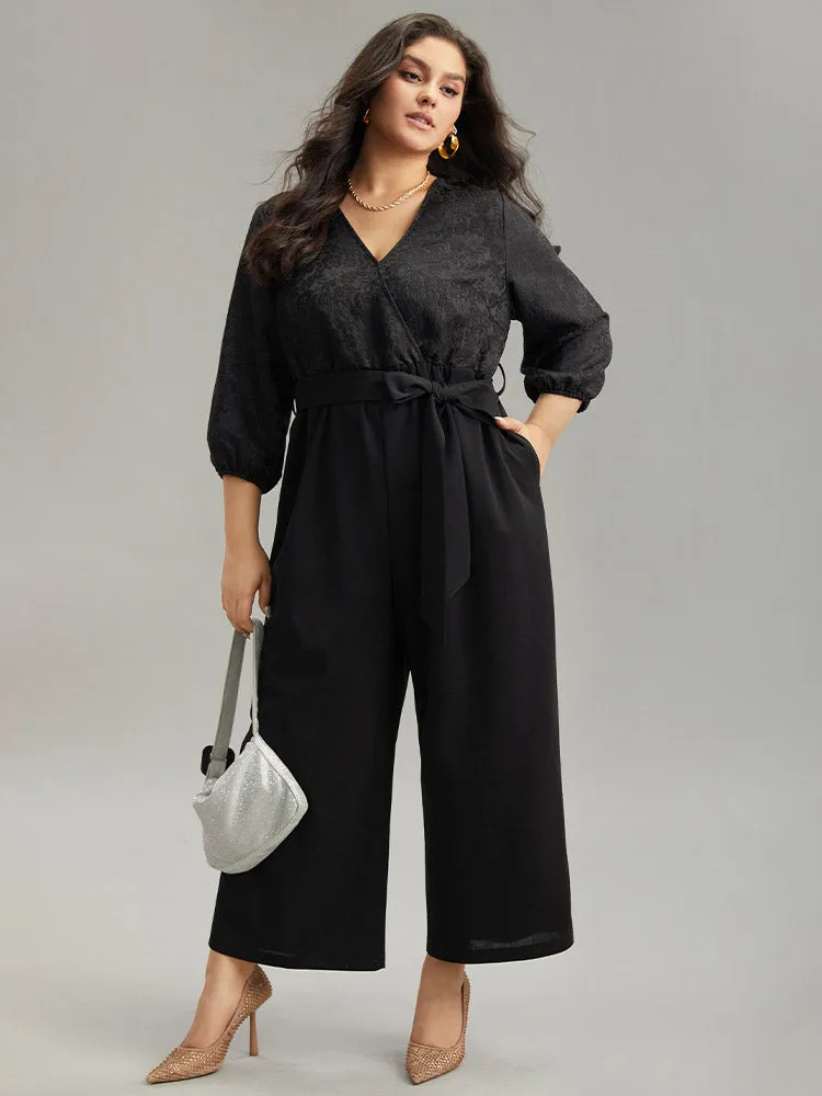 Plain Textured Belted Wrap Jumpsuit sold by Bloomchic