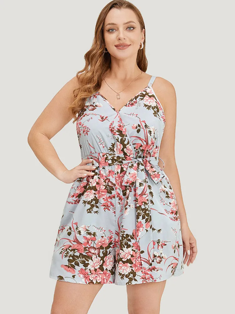 Floral Pocket Surplice Neck Belt Cami Romper sold by Bloomchic