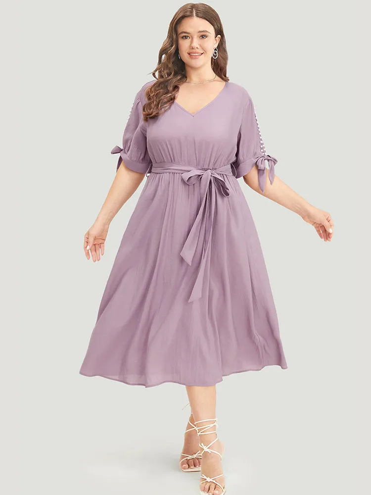 Plain Pearl Beaded Knotted Sleeve Pocket Belted Ruffle Dress sold by Bloomchic product image thumbnail 2