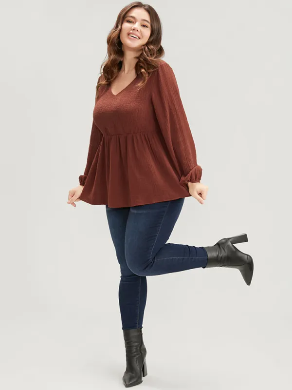 Solid V Neck Lantern Sleeve Shirred Ruffle Hem Blouse sold by Bloomchic