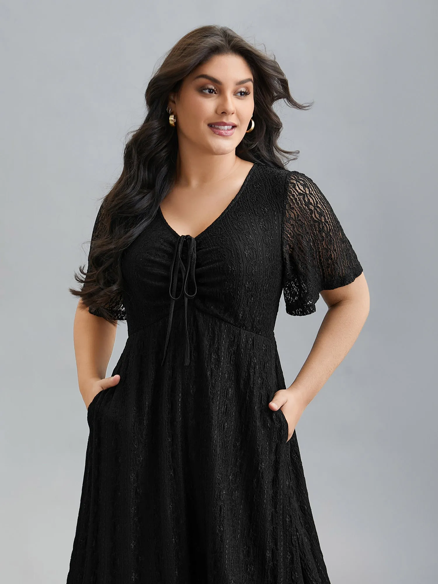 Lace V-Neck Bow Drawstring Midi Dress sold by Bloomchic