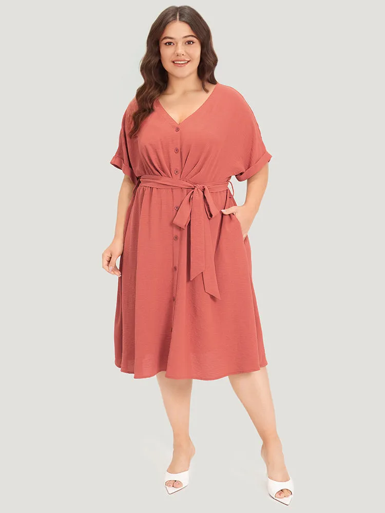 Solid Pocket Button Detail Ties Roll Sleeve Dress sold by Bloomchic product image thumbnail 2