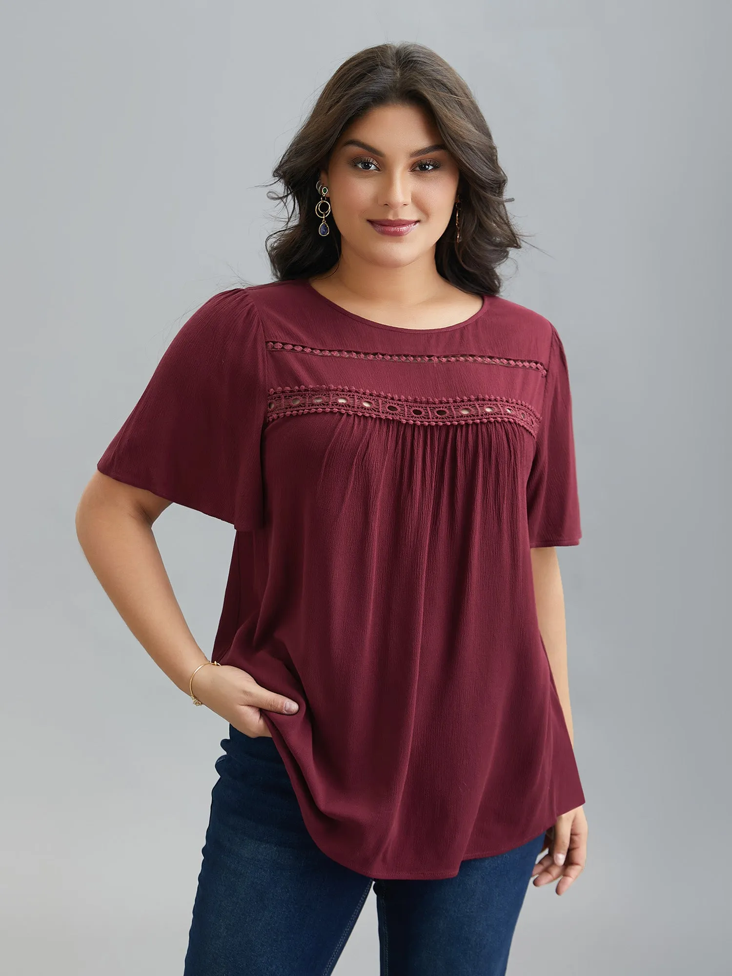 Lace Cut-Out Round Neck Pleated Shirt sold by Bloomchic