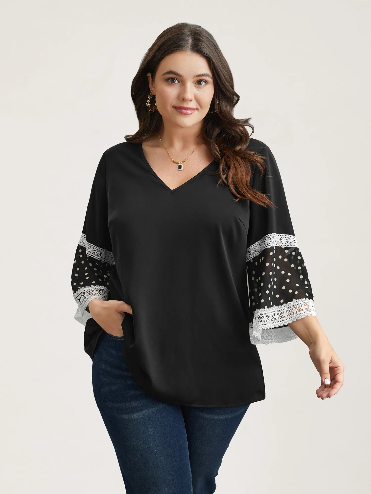 Polka Dot Paneled V-Neck Flared Shirt sold by Bloomchic