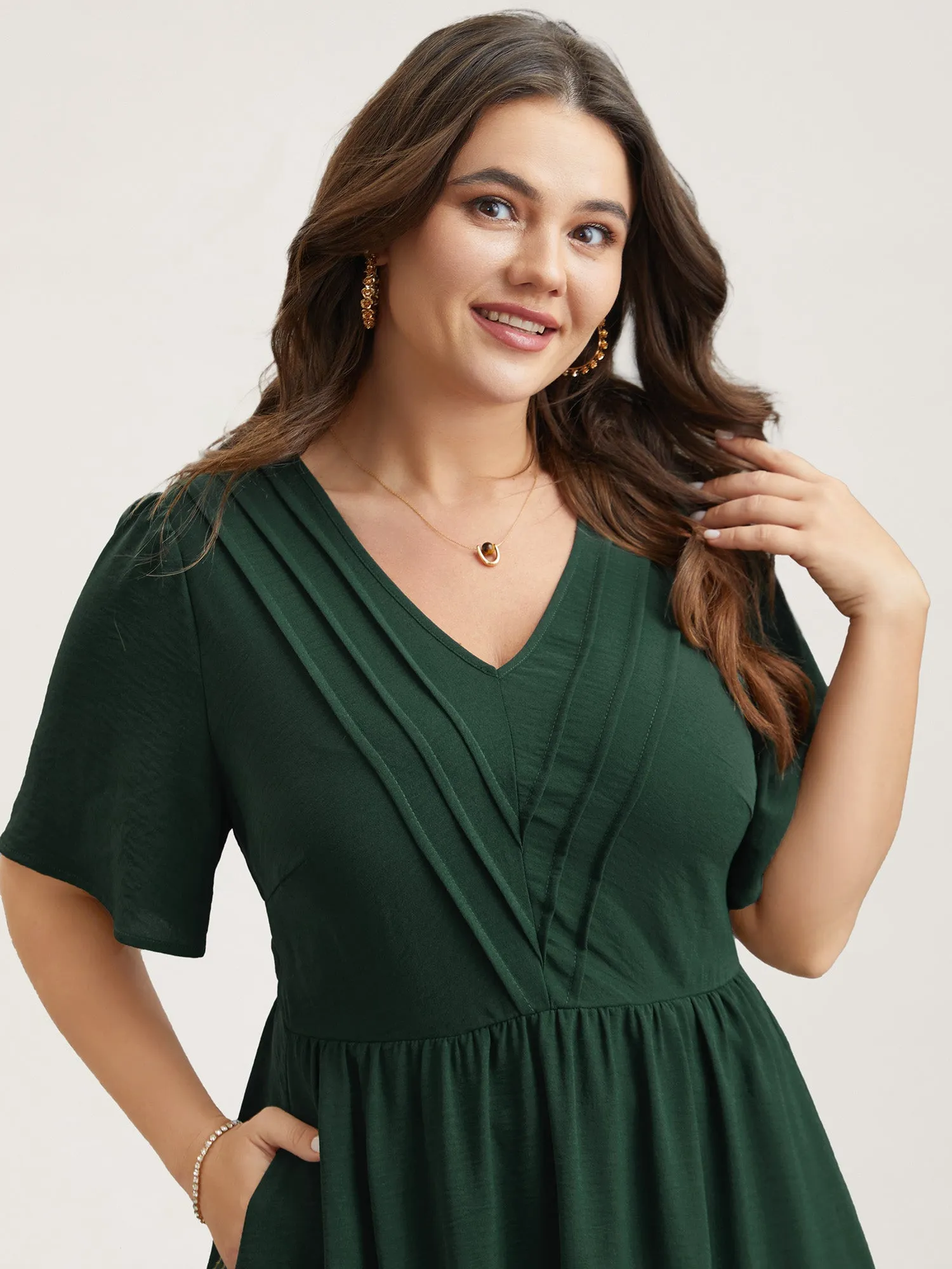 Bib-Front V-Neck Pockets Tiered Midi Dress sold by Bloomchic