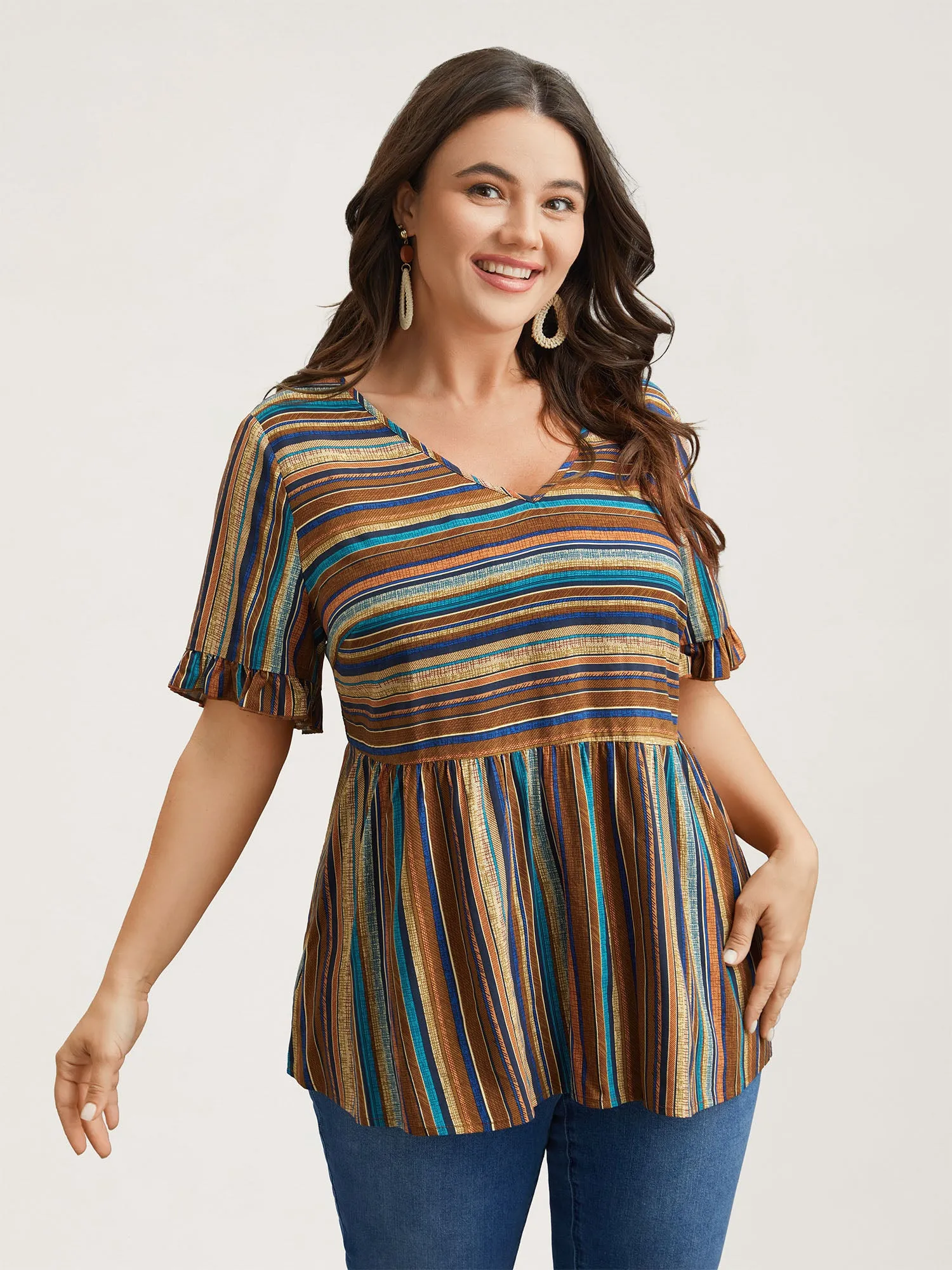 Striped V-Neck Peplum Shirt sold by Bloomchic