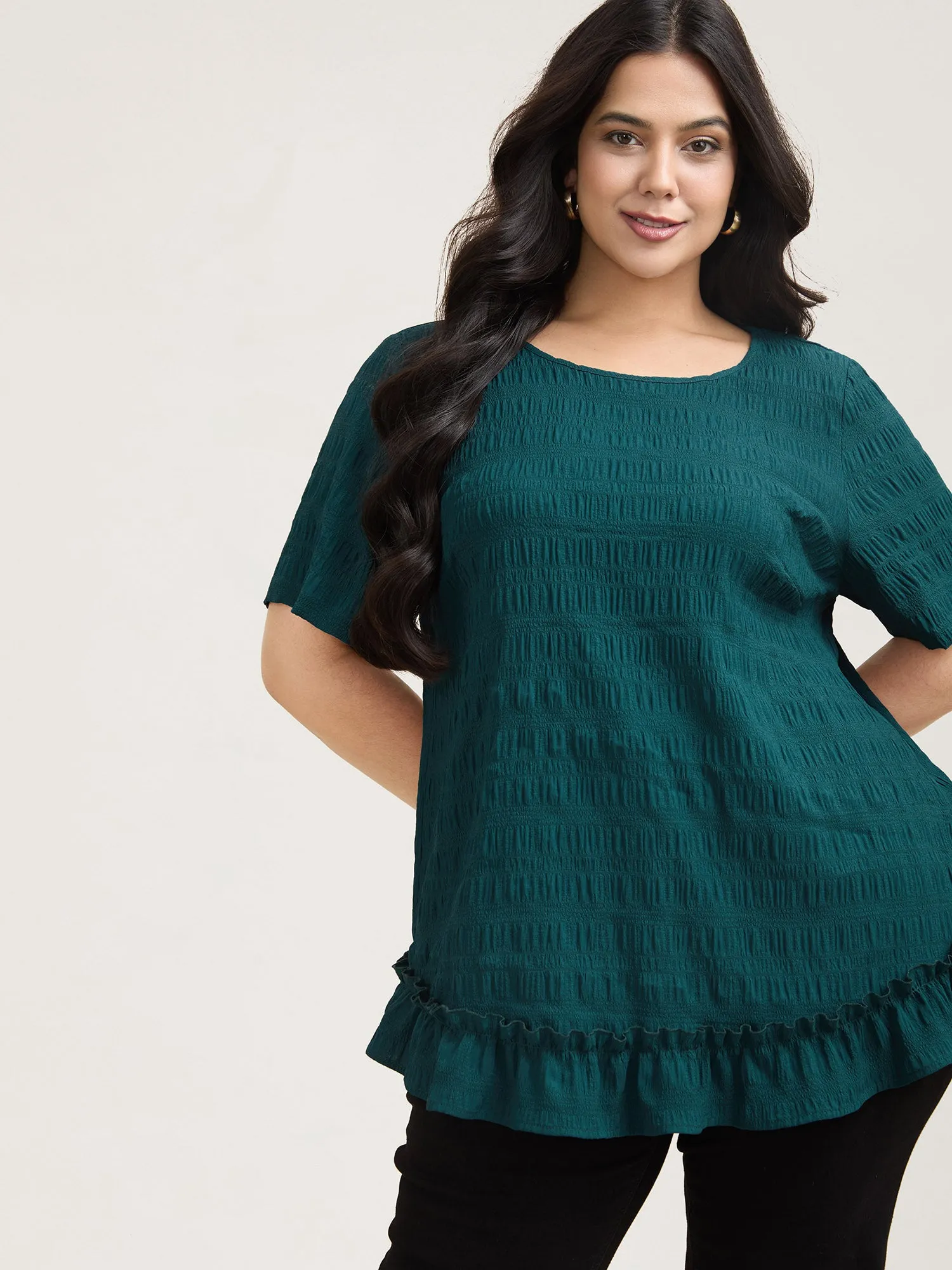 Textured Spliced Ruffle Edge Top sold by Bloomchic