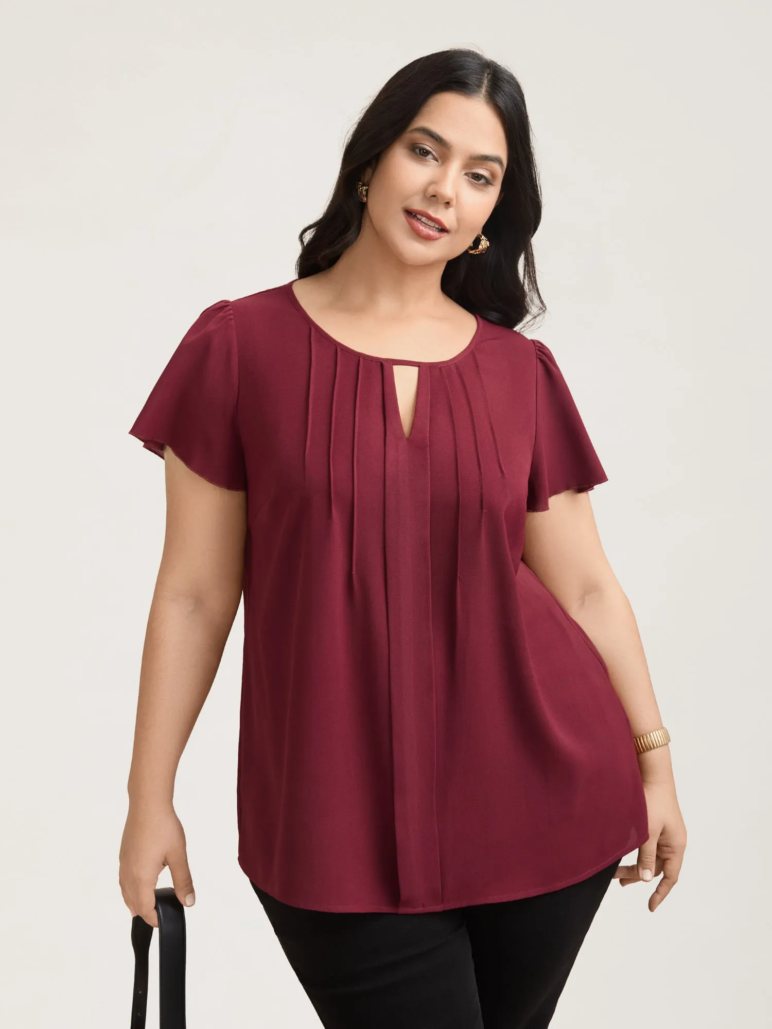 Plain Neck Cut-Out Pintuck Shirt sold by Bloomchic