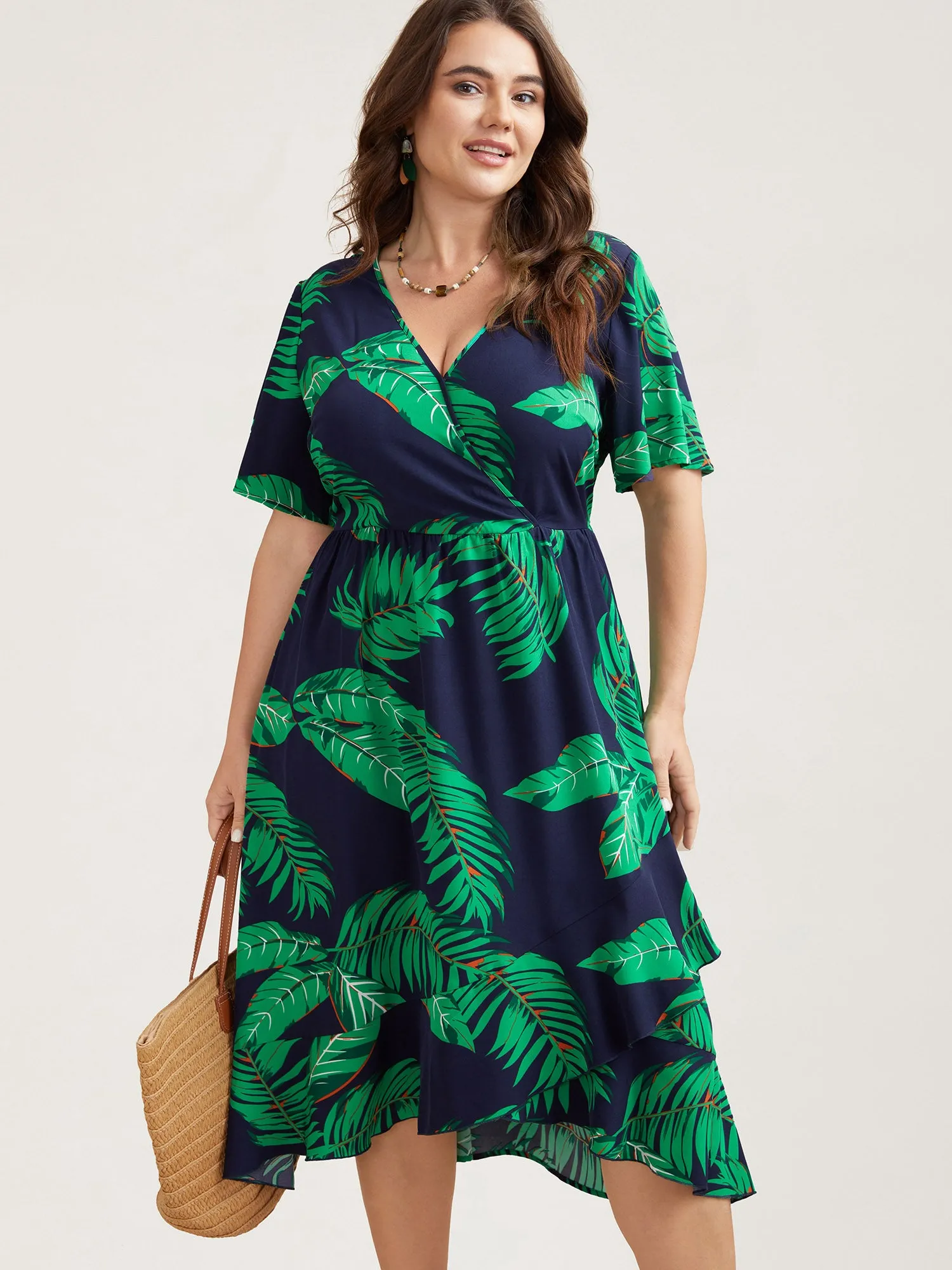 Tropical Leaf Print Surplice Neck Midi Dress sold by Bloomchic