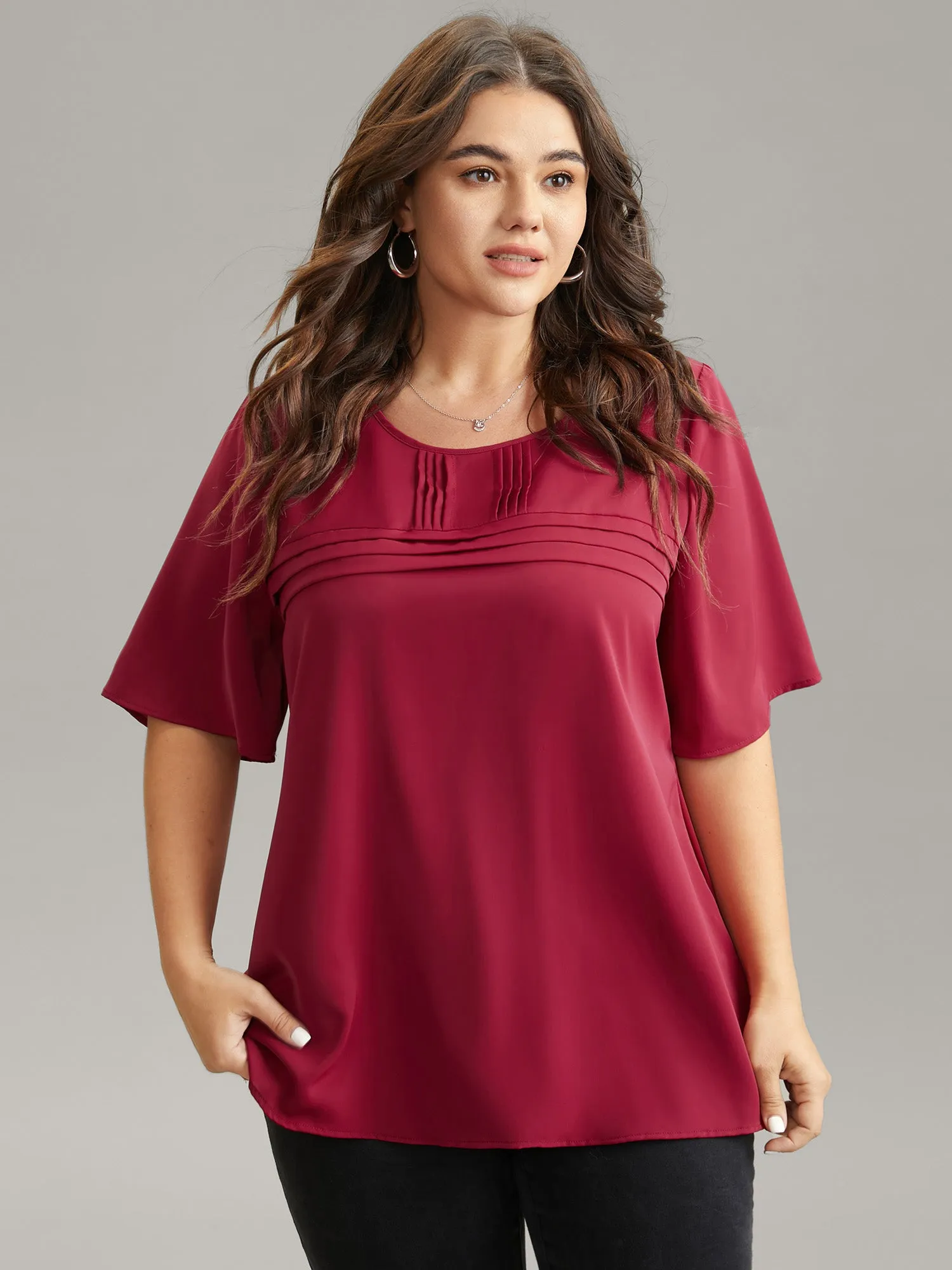 Solid Pleated Crew Neck Blouse sold by Bloomchic