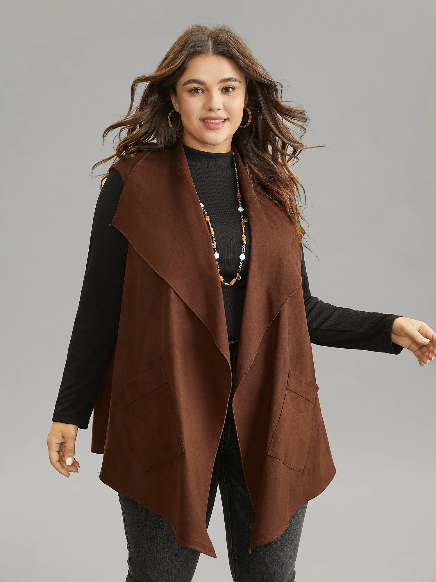 Faux Suede Asymmetrical Neck Pocket Vest sold by Bloomchic