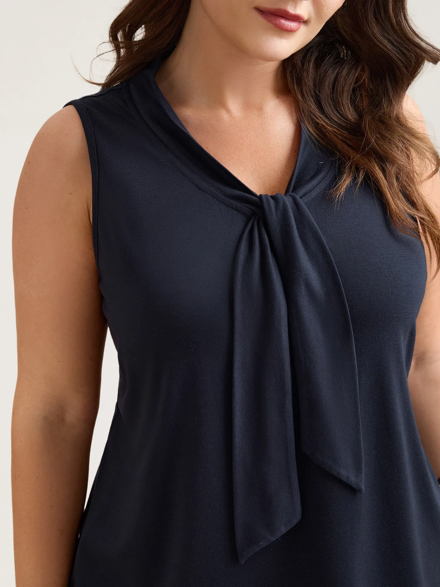 Knotted Neckline Fitted Sleeveless Blouse sold by Bloomchic