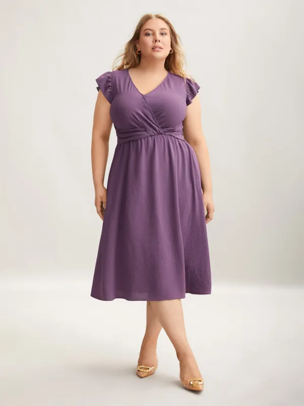 Solid Surplice Neck Pockets Midi Dress sold by Bloomchic