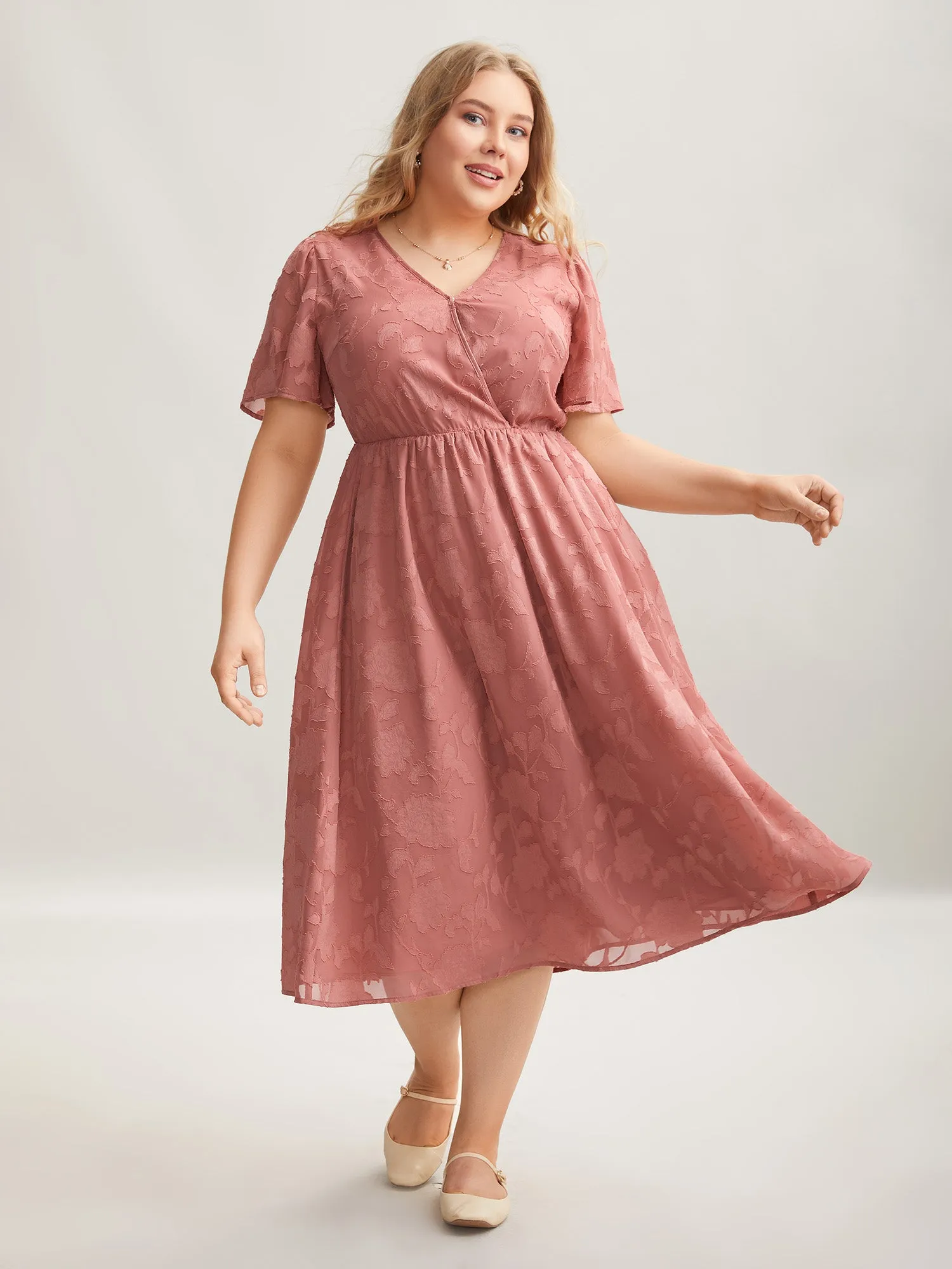 Textured Surplice Neck Flared Sleeve Midi Dress sold by Bloomchic