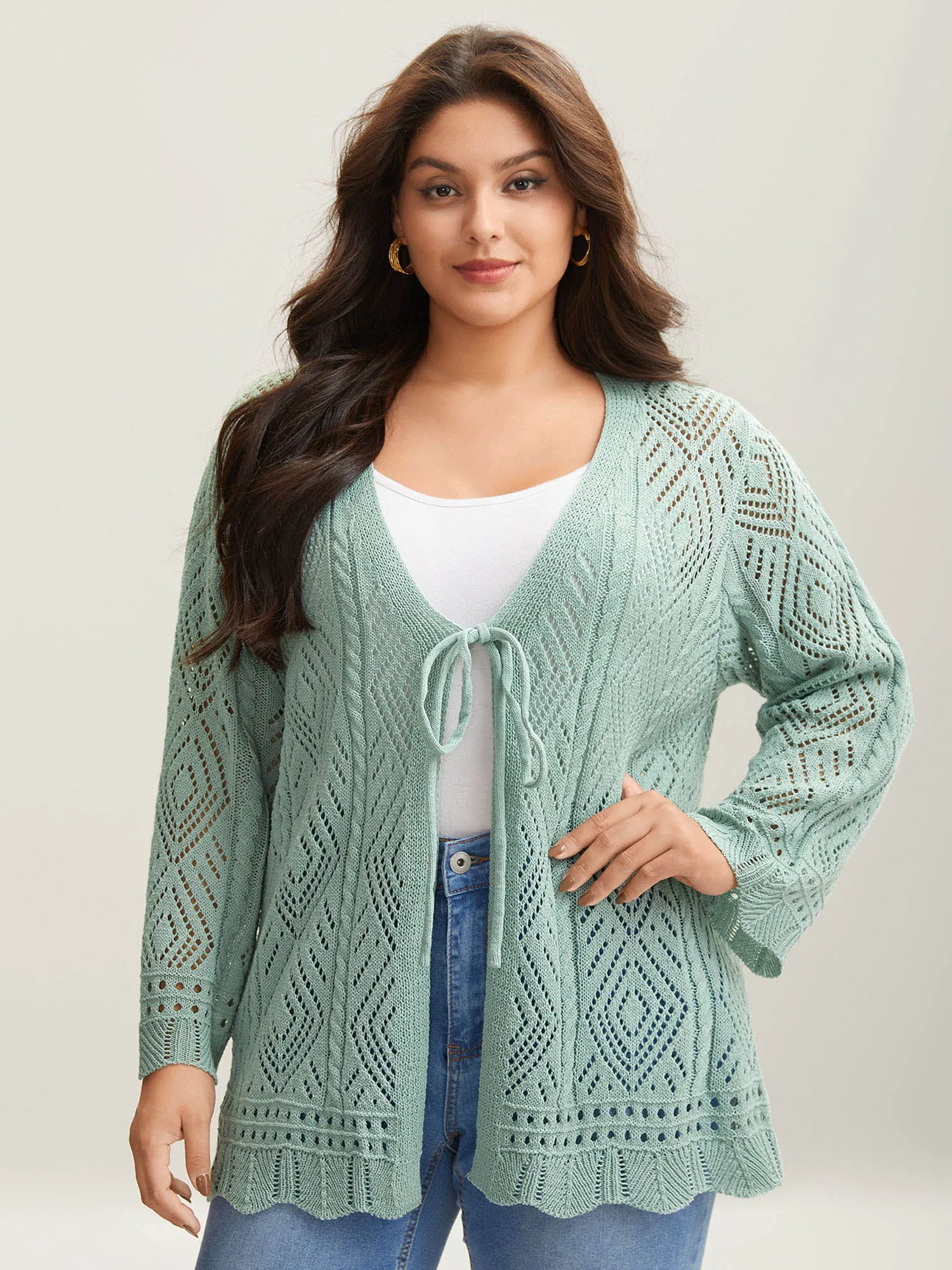 Cut-Out Textured Tied Knit Cardigan sold by Bloomchic