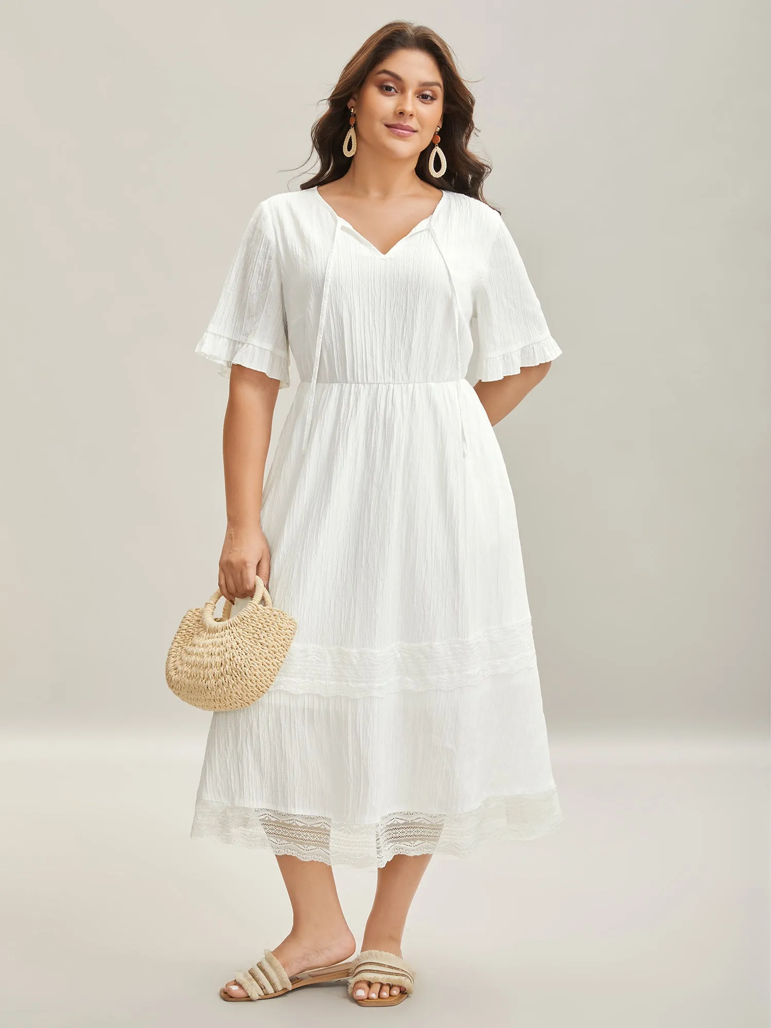 Textured Cut-Out Lace Tied Midi Dress sold by Bloomchic