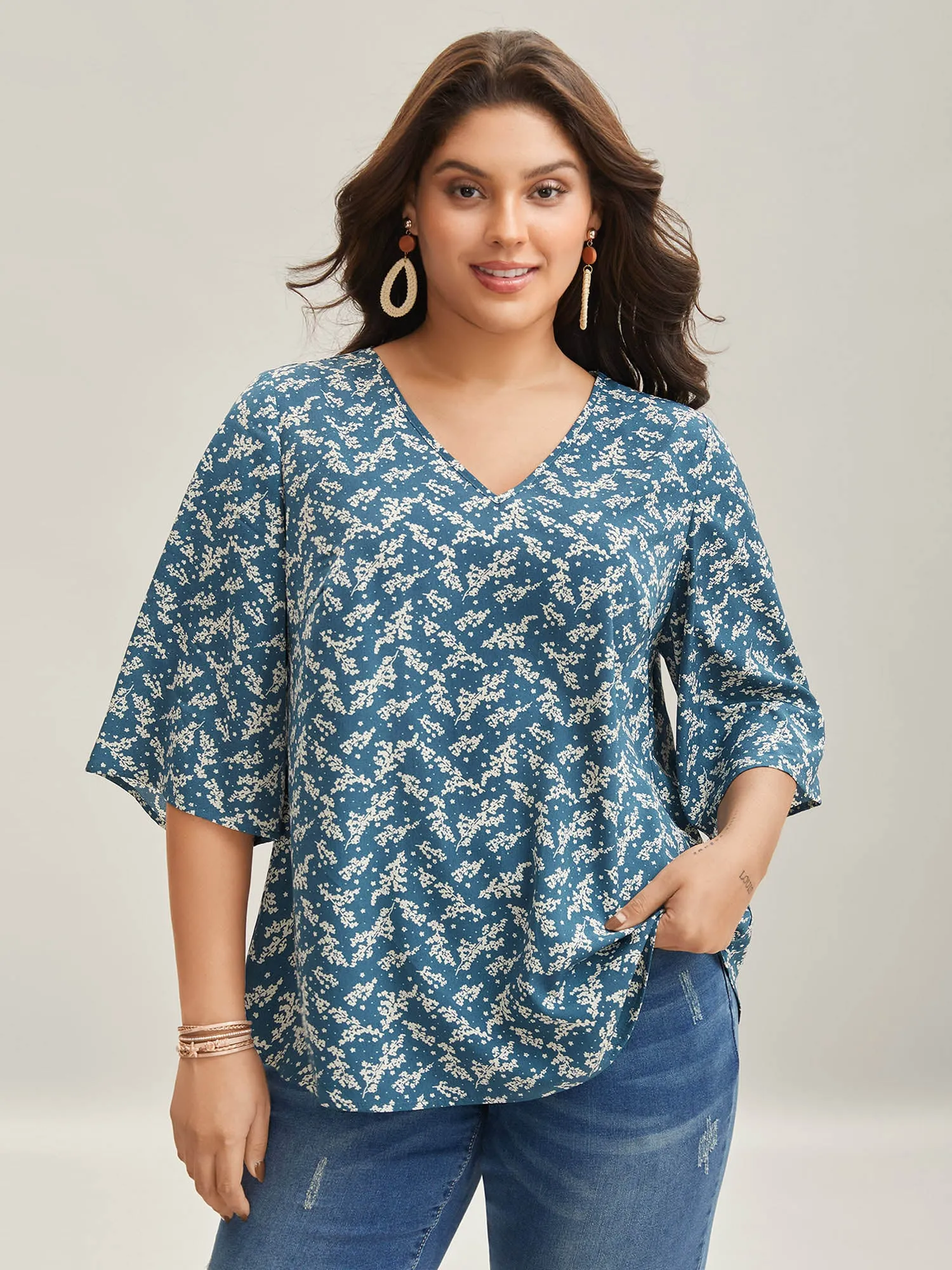Floral Print Curvy Hem V-Neck Shirt sold by Bloomchic