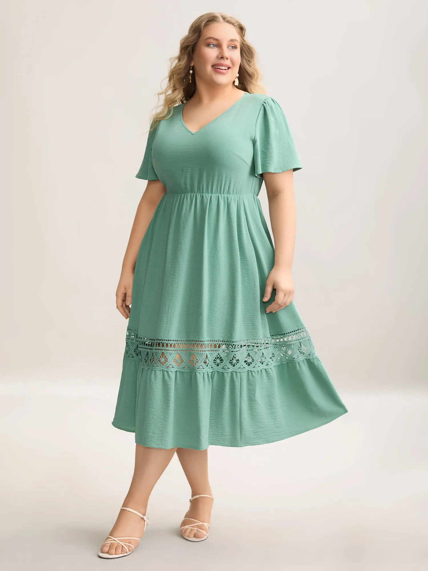 Lace Cut-Out Lotus Leaf Sleeve Midi Dress sold by Bloomchic