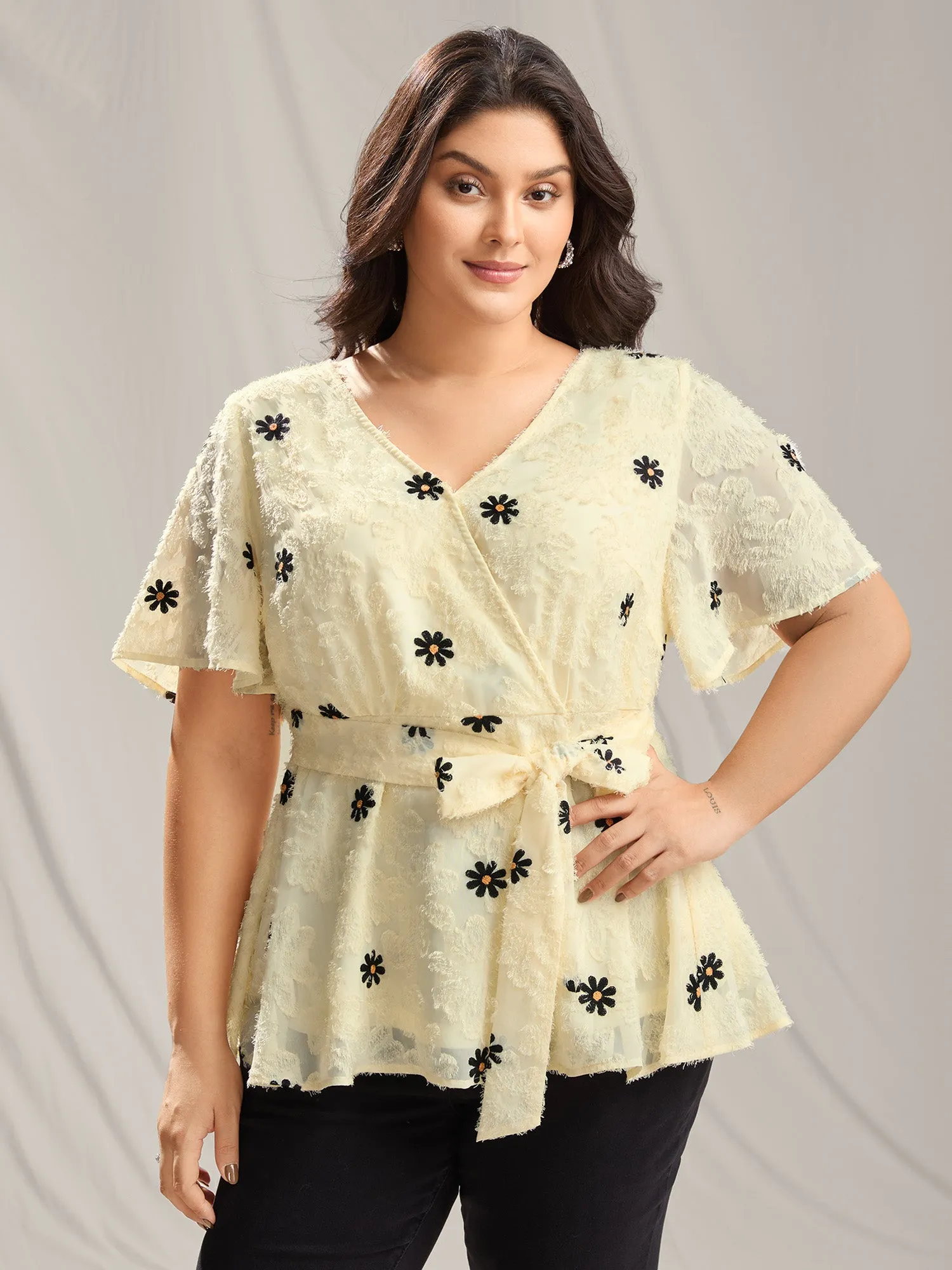 Textured Embroidery Surplice Belted Blouse sold by Bloomchic