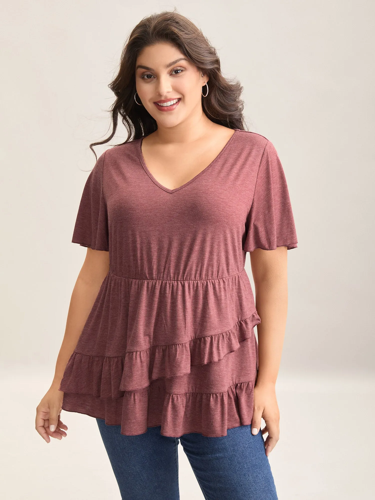 Plain Overlap Hem Tiered Knit Top sold by Bloomchic