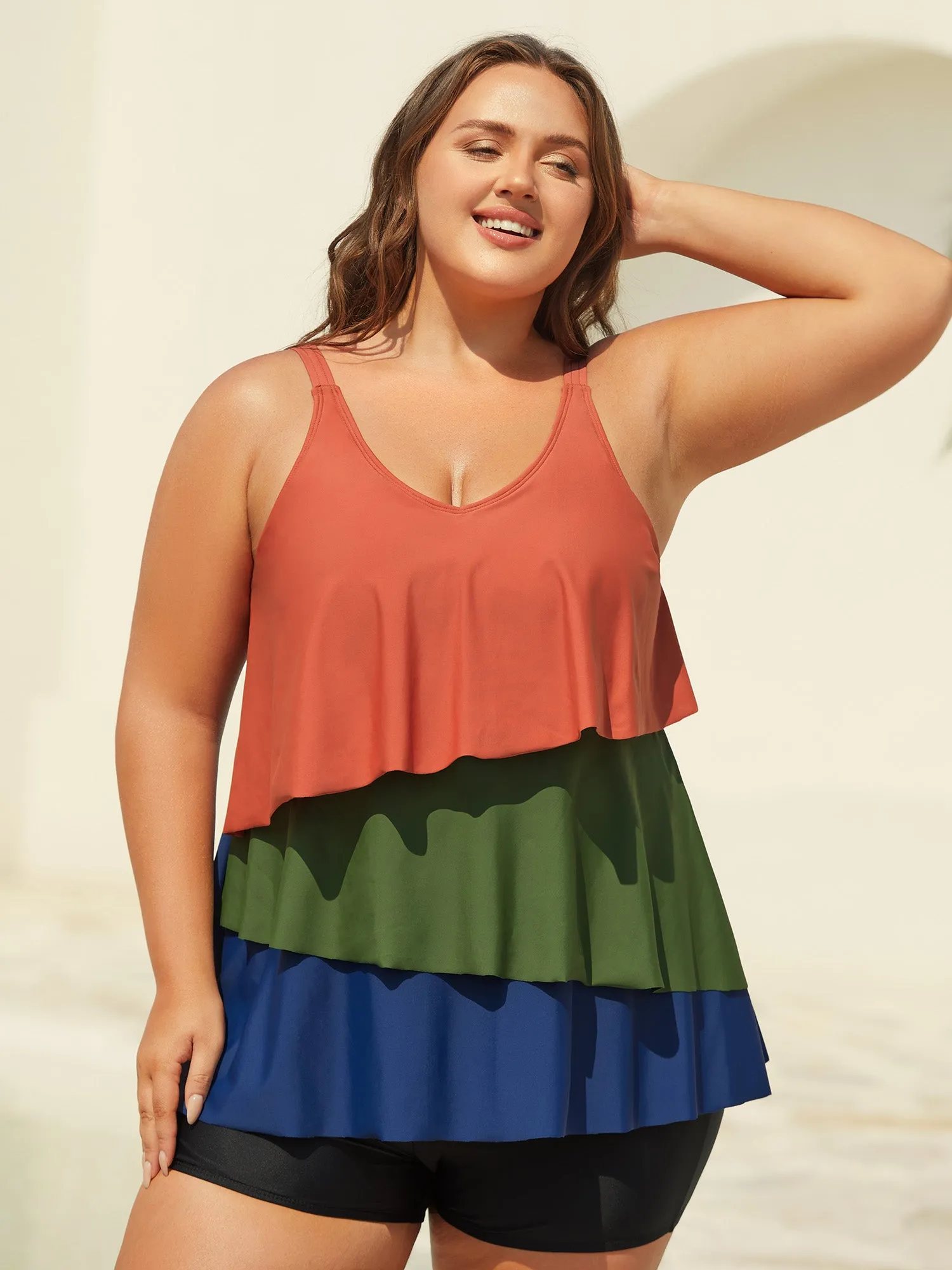 Color Block Asymmetrical Hem Swim Top sold by Bloomchic
