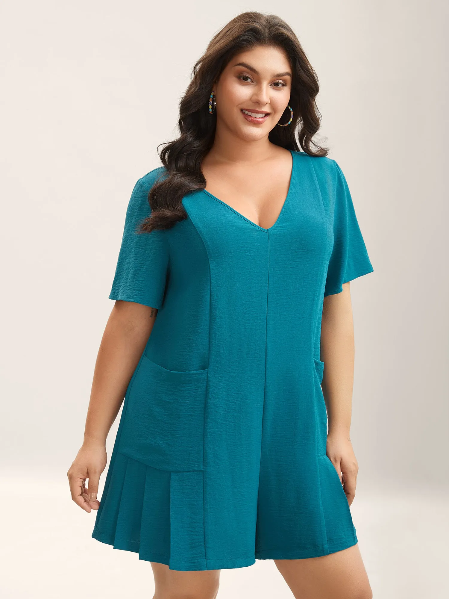 Relaxed Fit Pockets Seamed Solid Romper sold by Bloomchic