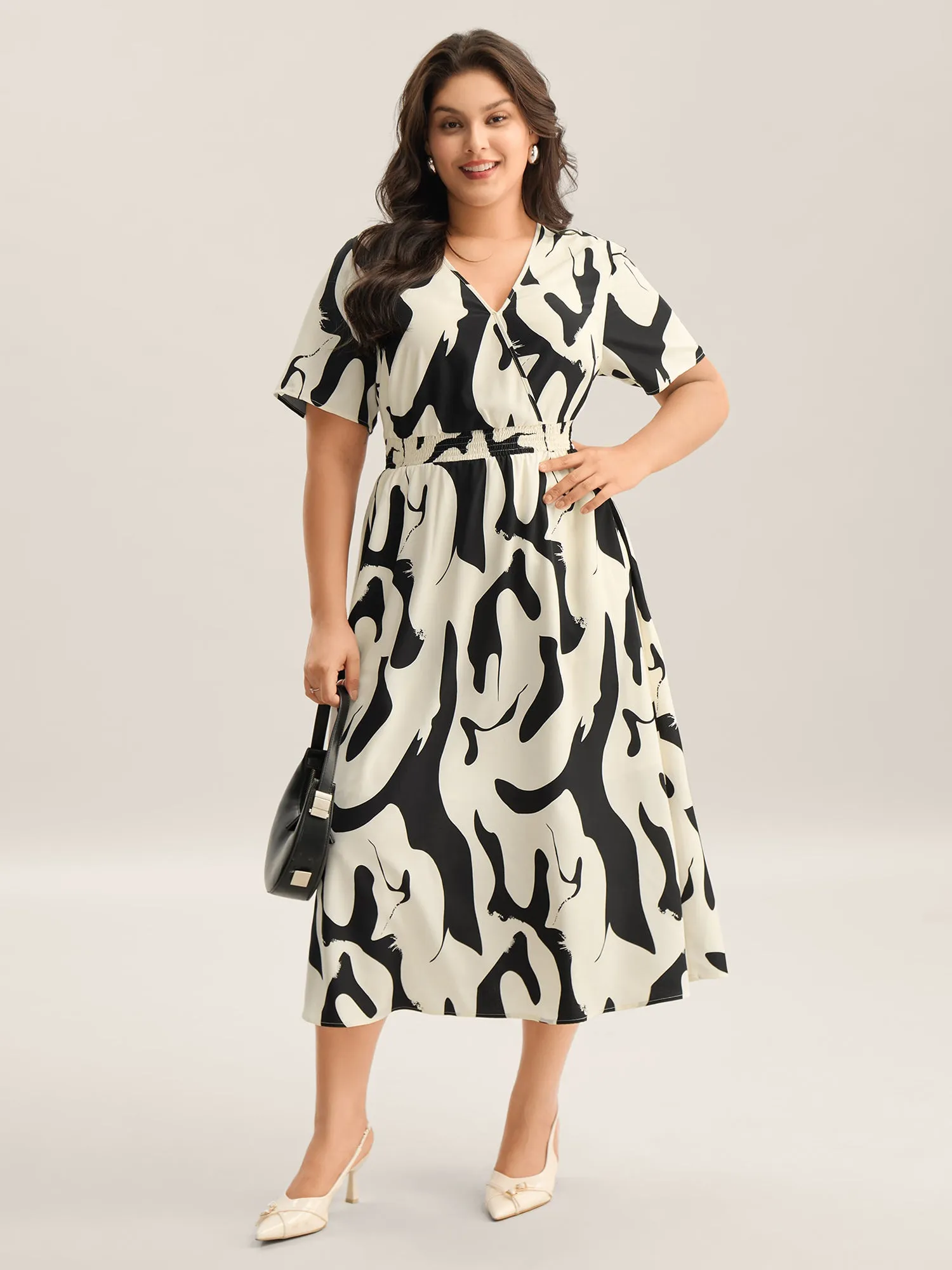 Geometric Print Surplice Neck Midi Dress sold by Bloomchic