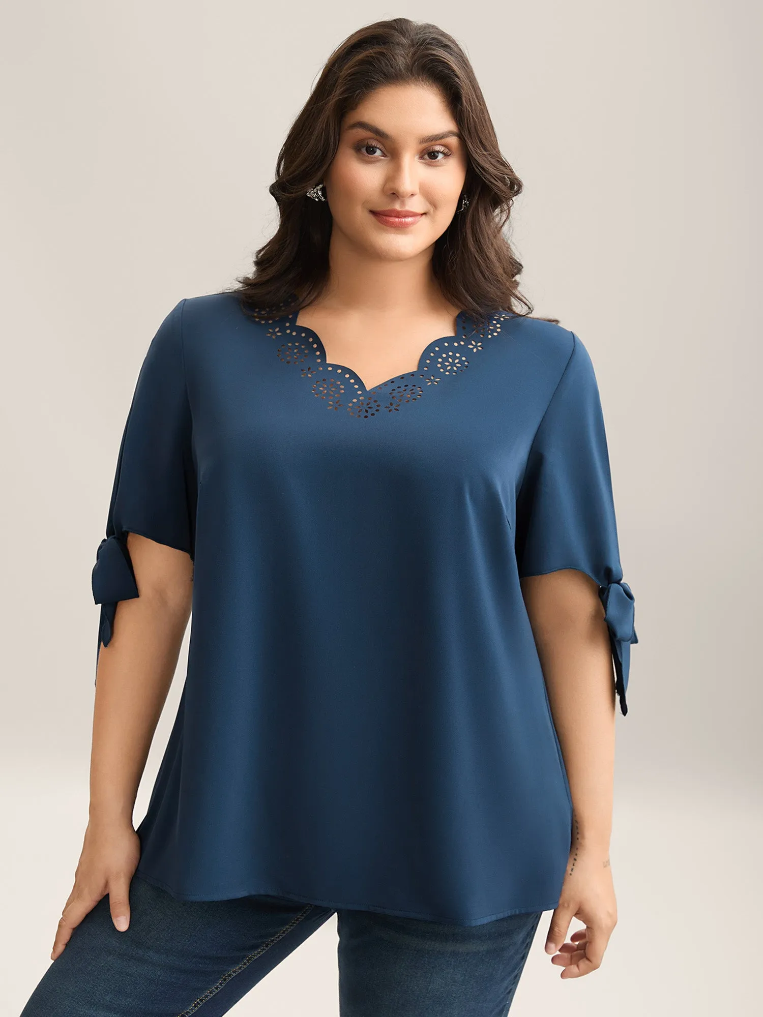 Laser Cut Neckline Knotted Sleeve Blouse sold by Bloomchic