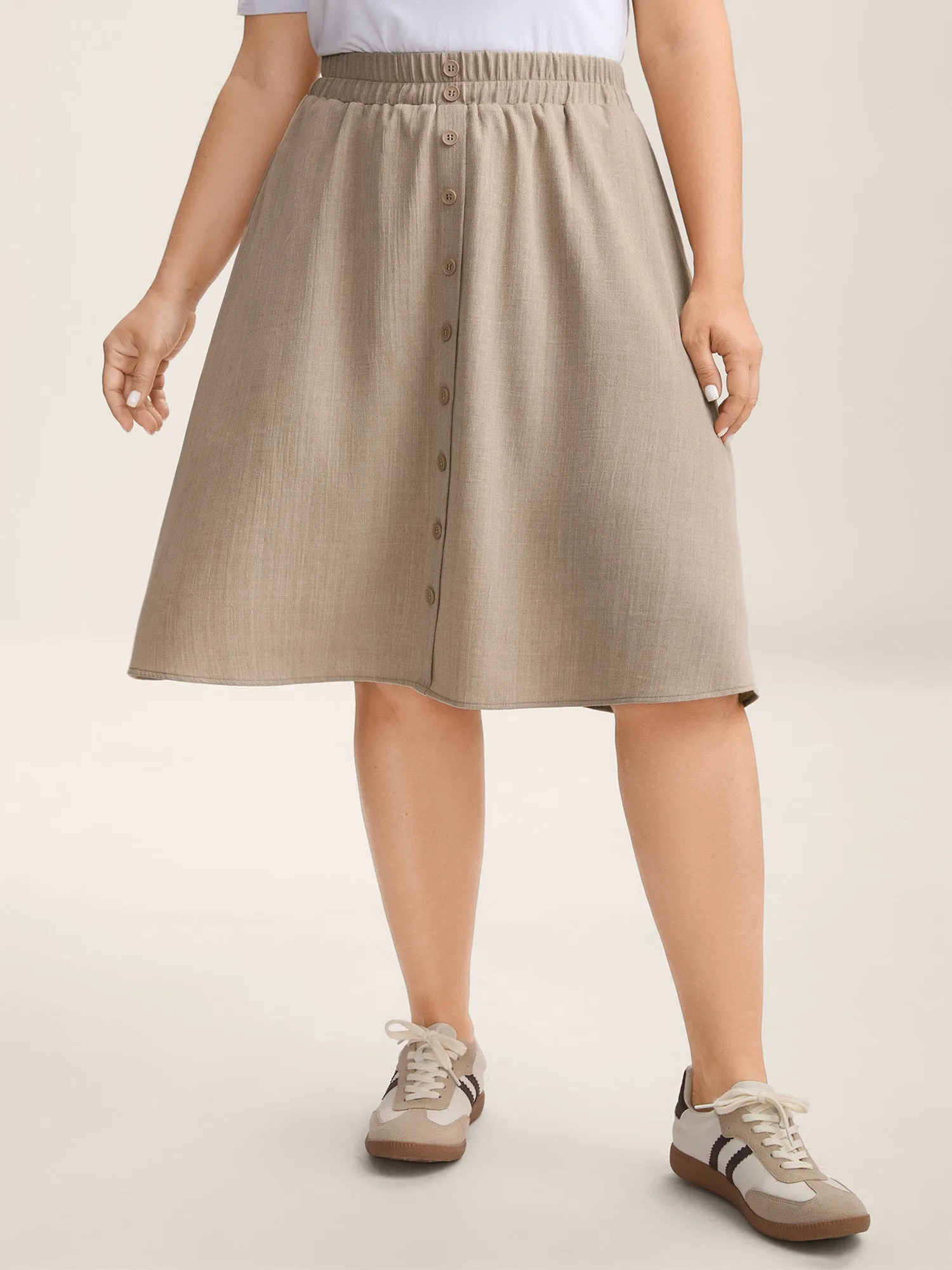 Button Detail Textured A-Line Midi Skirt sold by Bloomchic